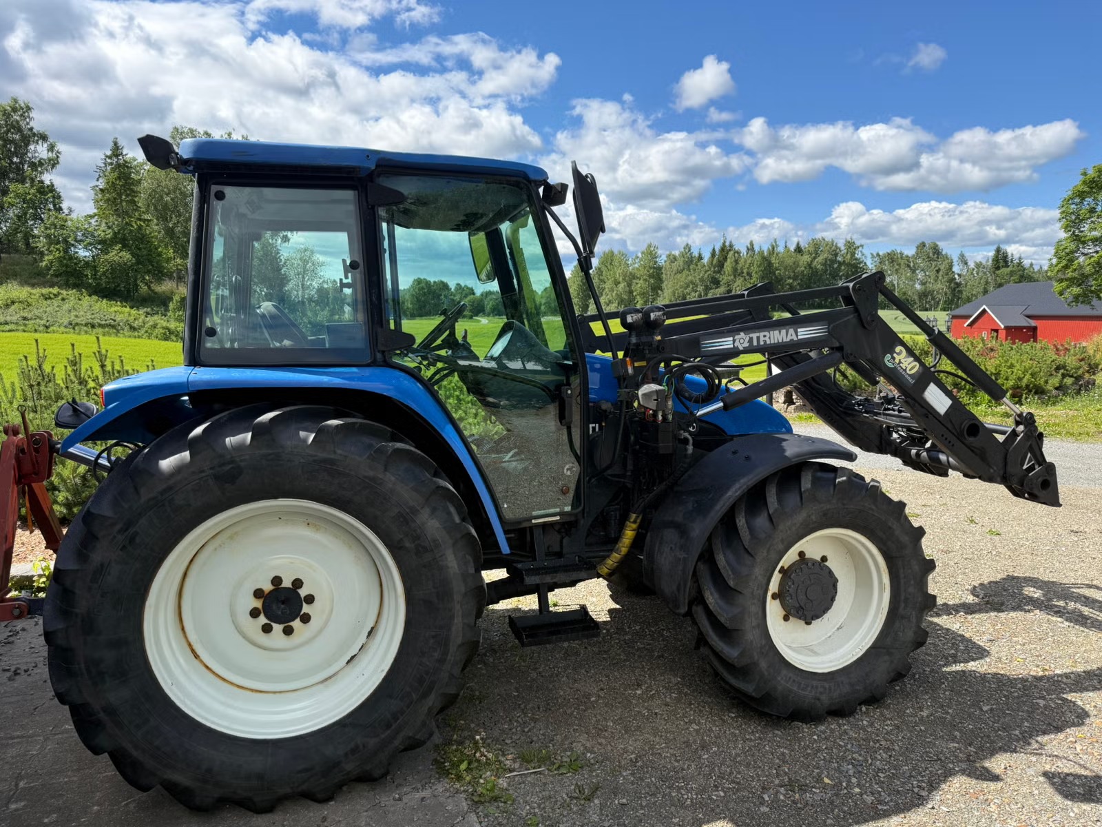 abc8e3e2-42de-40ac-825e-becb4425e087 New Holland TL100 - Imagen 1