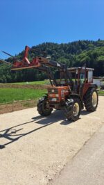 Tractor Fiat 55-66 DT con cargador frontal y horquilla